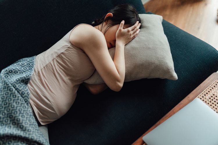 pregnant person on the couch